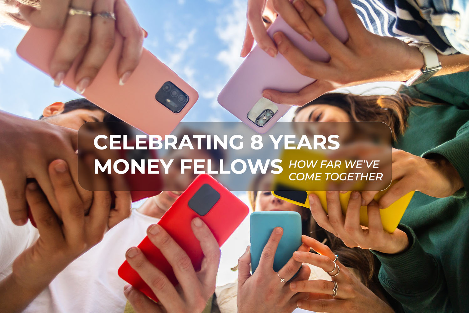 hands holding mobile phones in their hands from money fellows anniversary article on 3elm Elgeib blog